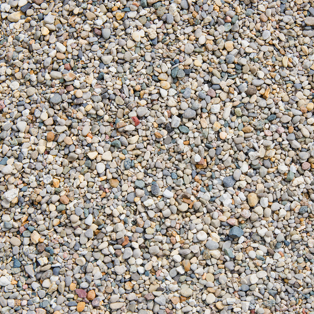 A texture portrait of pea gravel, which are small rocks of